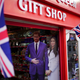 Life-size photographs of Prince Harry and his fiancee, Meghan Markle, are displayed in a gift shop on May 2, 2018, in Windsor, England.